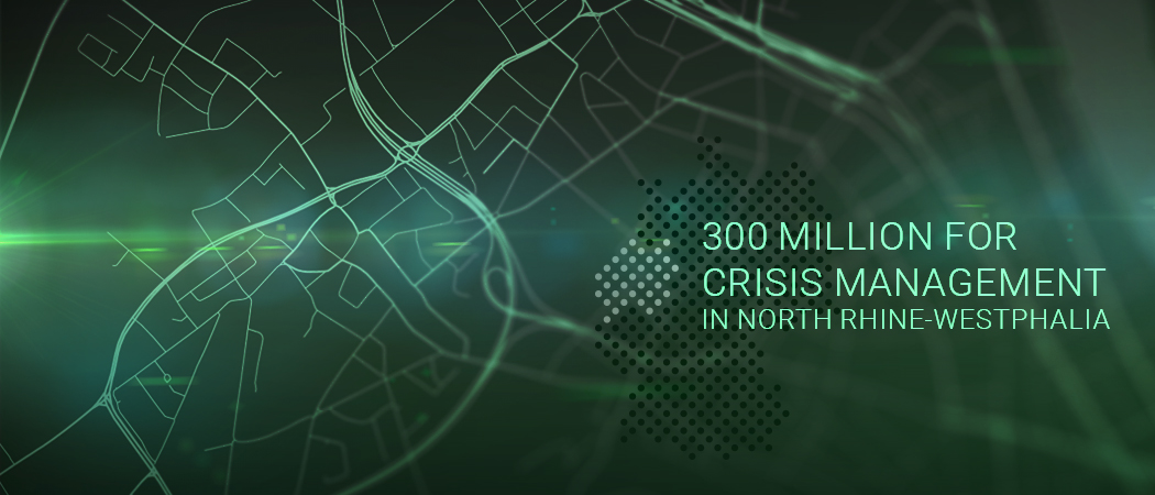 Visual representation of digital map with text: "300 million for crisis management in North Rhine-Westphalia", highlighting regional cybersecurity funding.